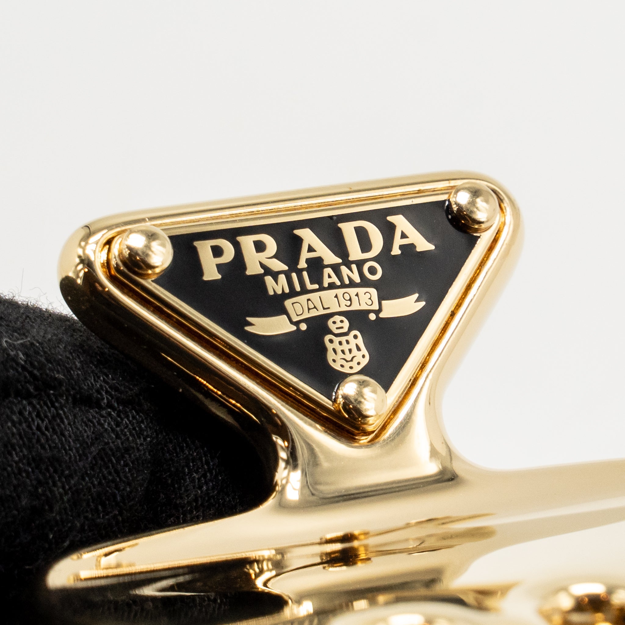 Prada hair clip gold metal